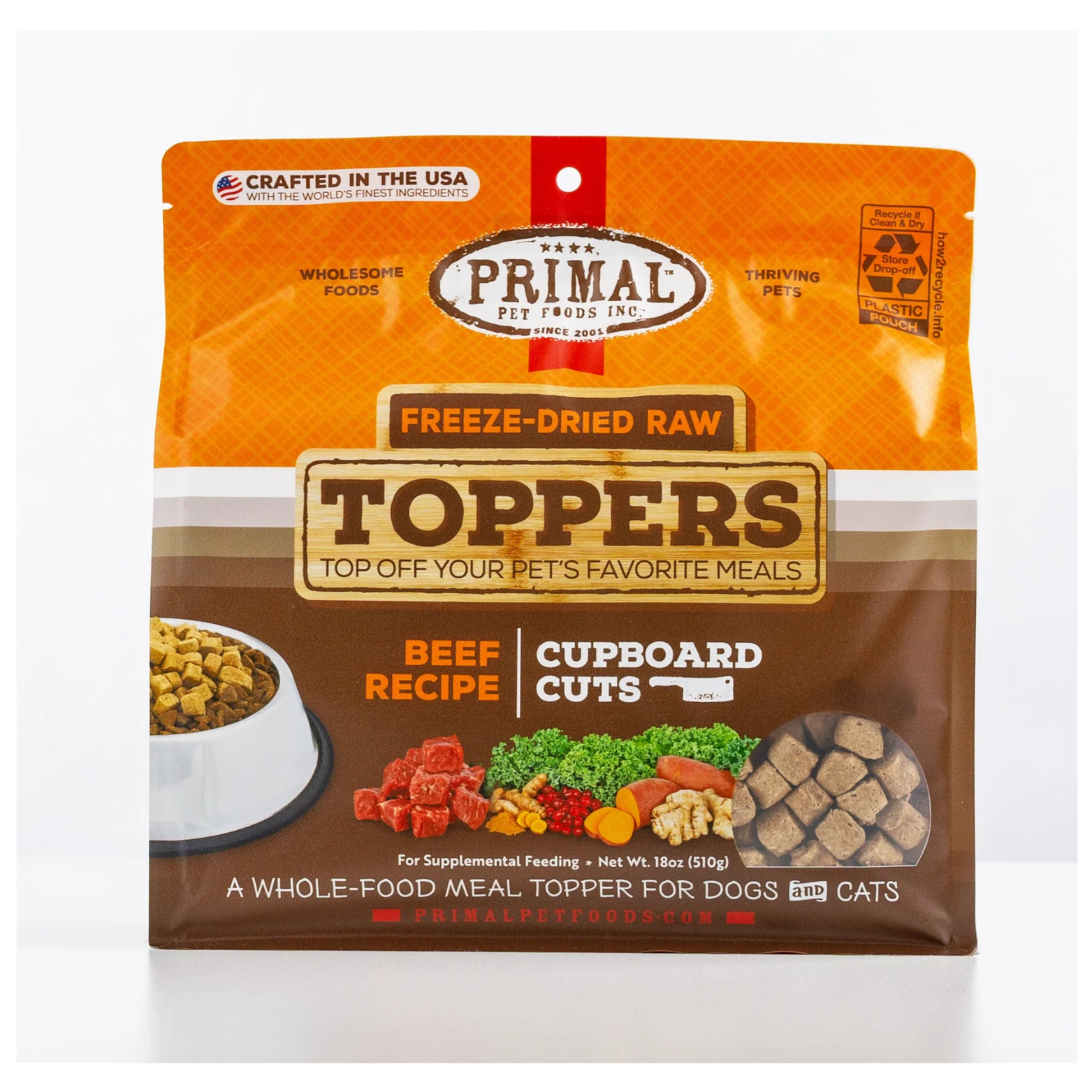 Front view of a Primal Pet Foods freeze-dried raw toppers pouch labeled “Beef Recipe – Cupboard Cuts,” showing product cubes, vegetables, and a dog food bowl, with text indicating it is a whole-food meal topper for dogs and cats.
