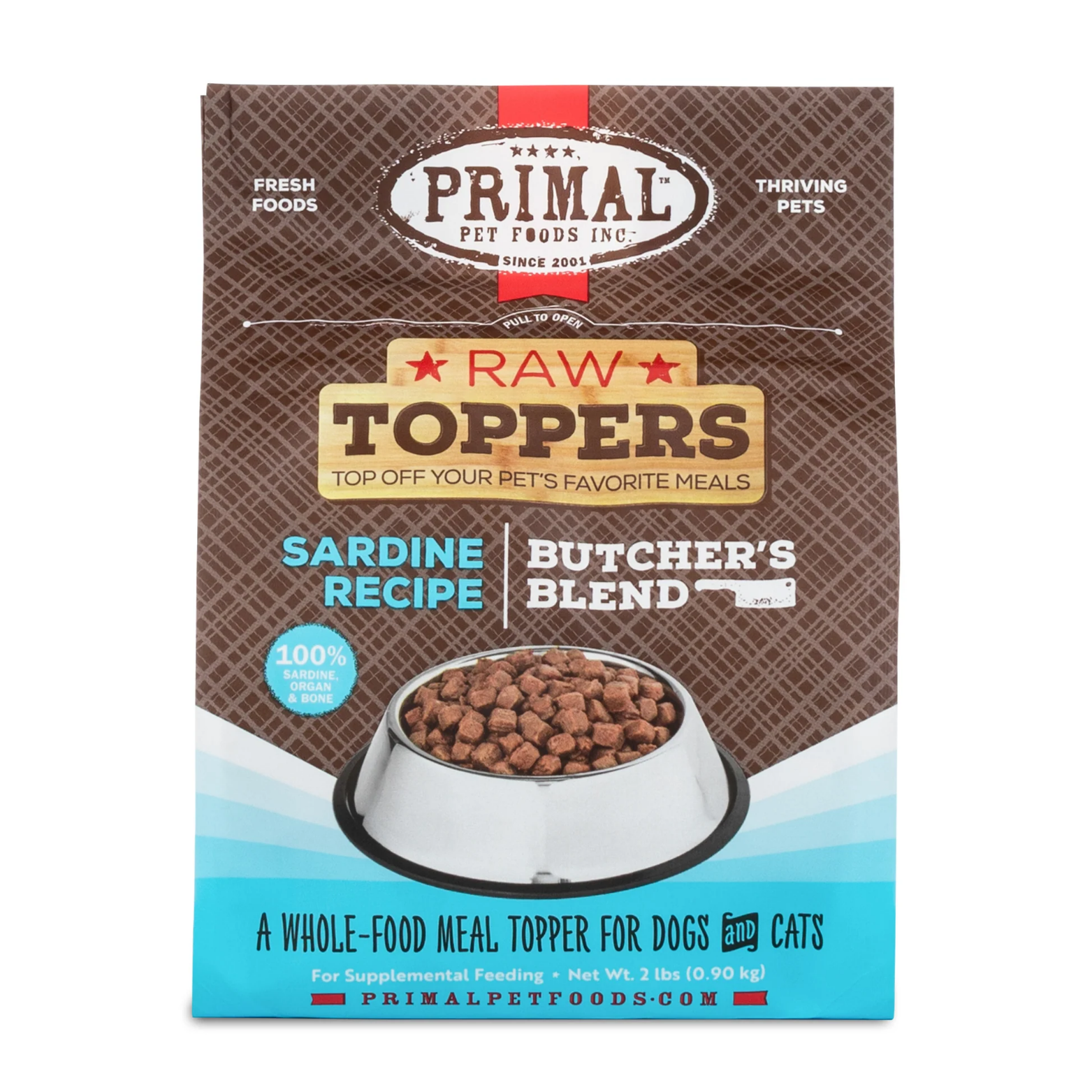 Front of a Primal Pet Foods Raw Toppers bag labeled “Sardine Recipe Butcher’s Blend,” featuring a bowl filled with small cube-shaped raw food pieces. The packaging highlights 100% sardine, organ, and bone and describes the product as a whole-food meal topper for dogs and cats, net weight 2 lb.