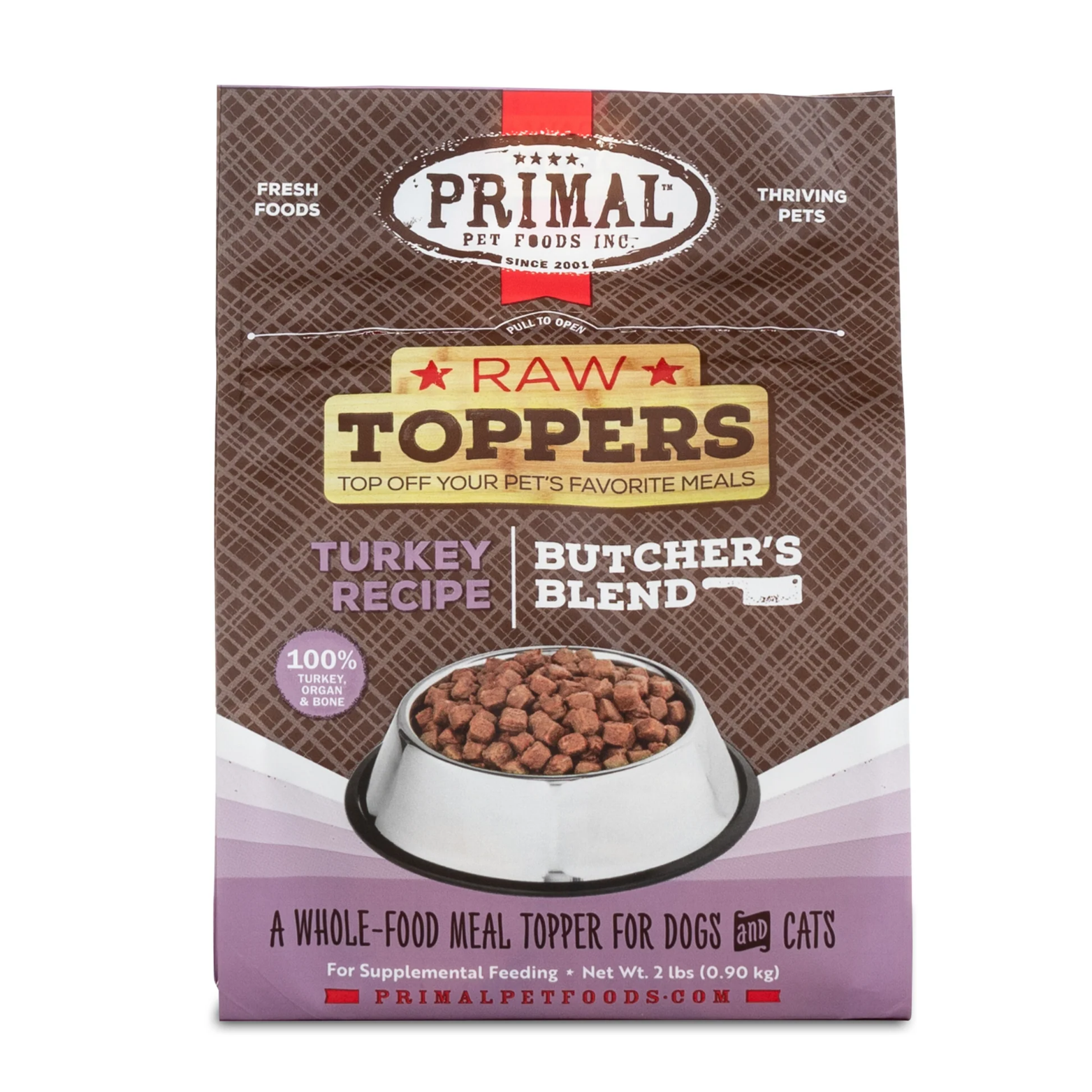 Front of a Primal Pet Foods Raw Toppers bag labeled “Turkey Recipe Butcher’s Blend,” featuring a bowl filled with small cube-shaped raw food pieces. The packaging highlights 100% turkey, organ, and bone and describes the product as a whole-food meal topper for dogs and cats, net weight 2 lb.