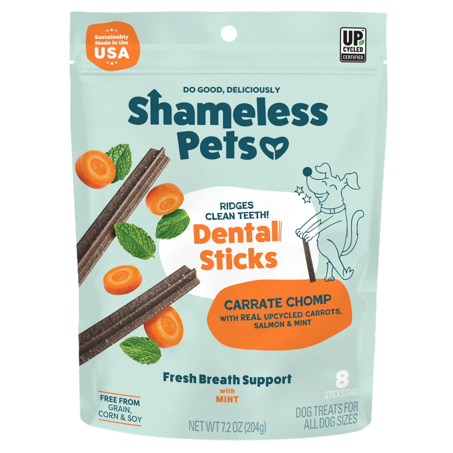 Front of a mint-green Shameless Pets bag labeled “Dental Sticks – Carrate Chomp,” featuring ridged dental sticks, sliced carrots, mint leaves, and a cartoon dog. Text highlights fresh breath support, made in the USA, and upcycled ingredients.