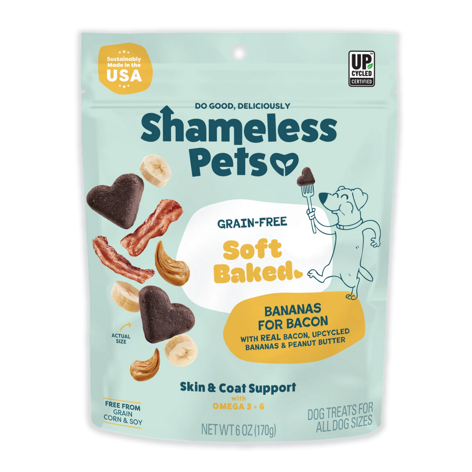 Front view of a light teal Shameless Pets dog treat bag labeled “Grain-Free Soft Baked Bananas for Bacon,” featuring heart-shaped dark brown treats, banana slices, bacon strips, and peanut butter swirls, with icons noting sustainably made in the USA, upcycled ingredients, and skin and coat support with omega 3 and 6.