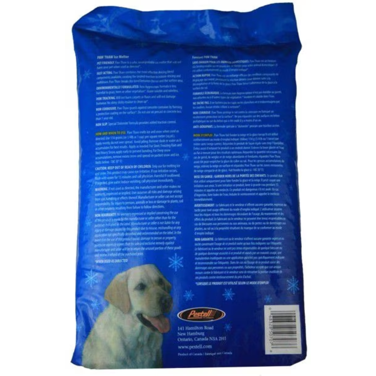 Back view of a blue bag of pet-safe ice melter with snowflake graphics. The bag contains multiple blocks of small white instructional text, a barcode on the lower right, and a photo of a light-colored Labrador retriever near the bottom. Manufacturer information and warnings are printed across the back.