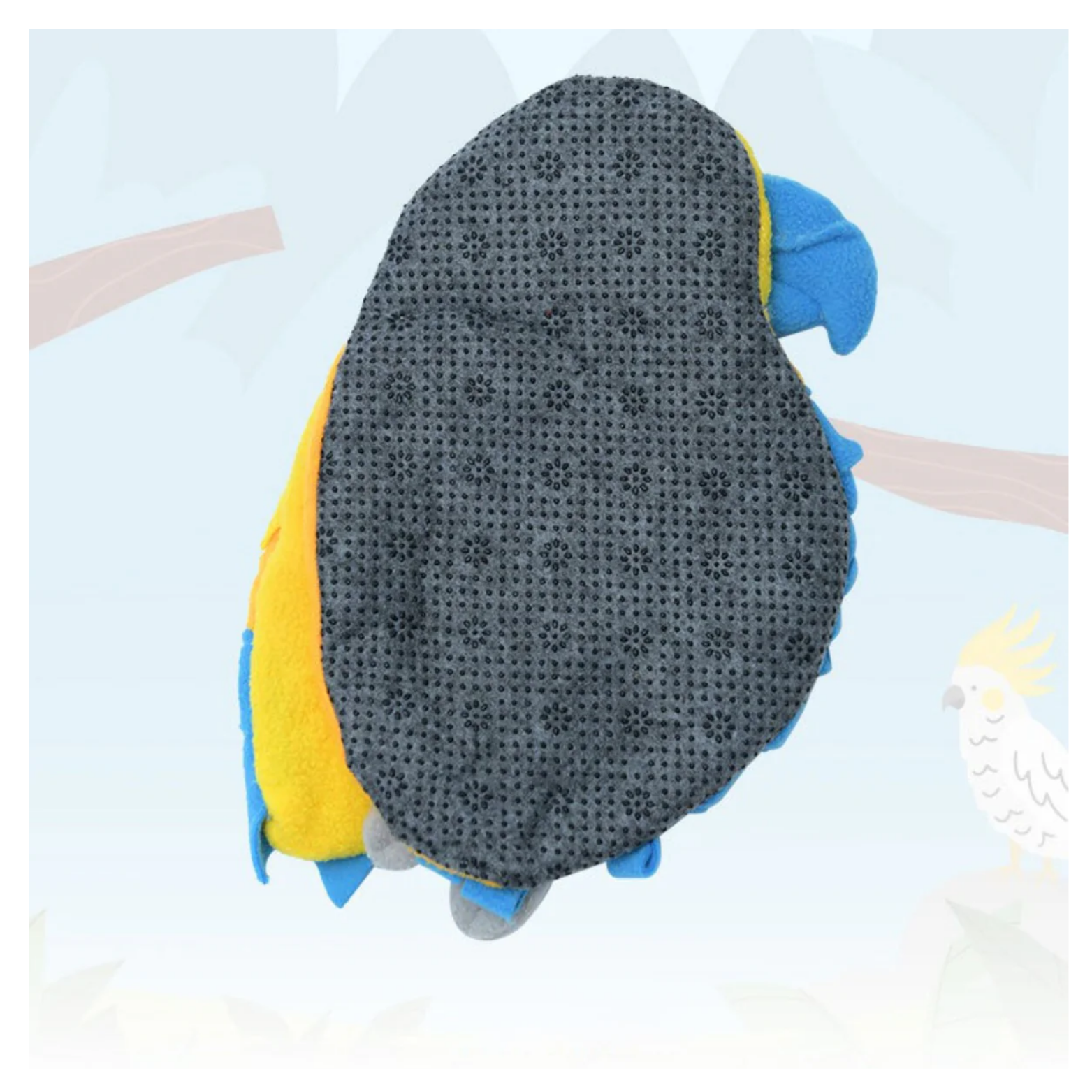 Back view of the parrot snuffle mat showing a dark gray non-slip base with textured grip dots, with blue and yellow fleece edges and the bird’s feet visible.