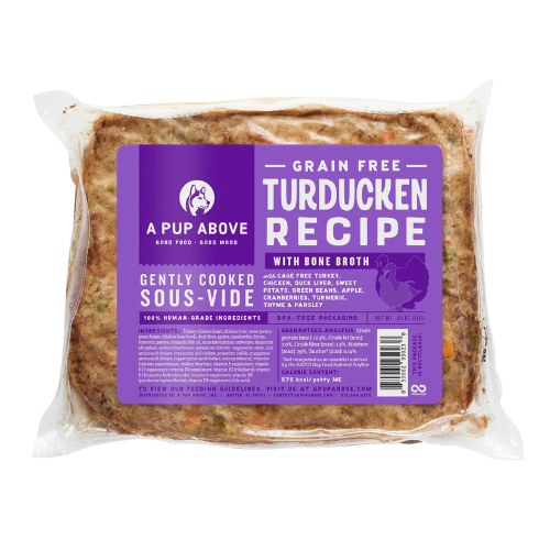 Vacuum-sealed package of A Pup Above Grain Free Turducken Recipe dog food, showing the cooked sous-vide food inside and a purple label with product details and ingredients.