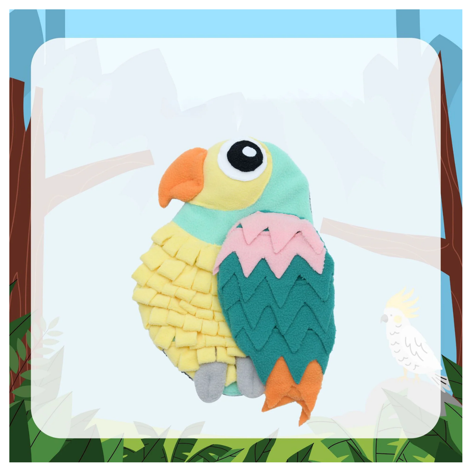 Green and yellow parrot-shaped snuffle feeding mat for dogs and cats made from soft fleece strips, featuring a mint-green head, yellow layered body feathers, teal and pink wing accents, an orange beak, large cartoon eye, and gray feet, displayed against a jungle-themed background.