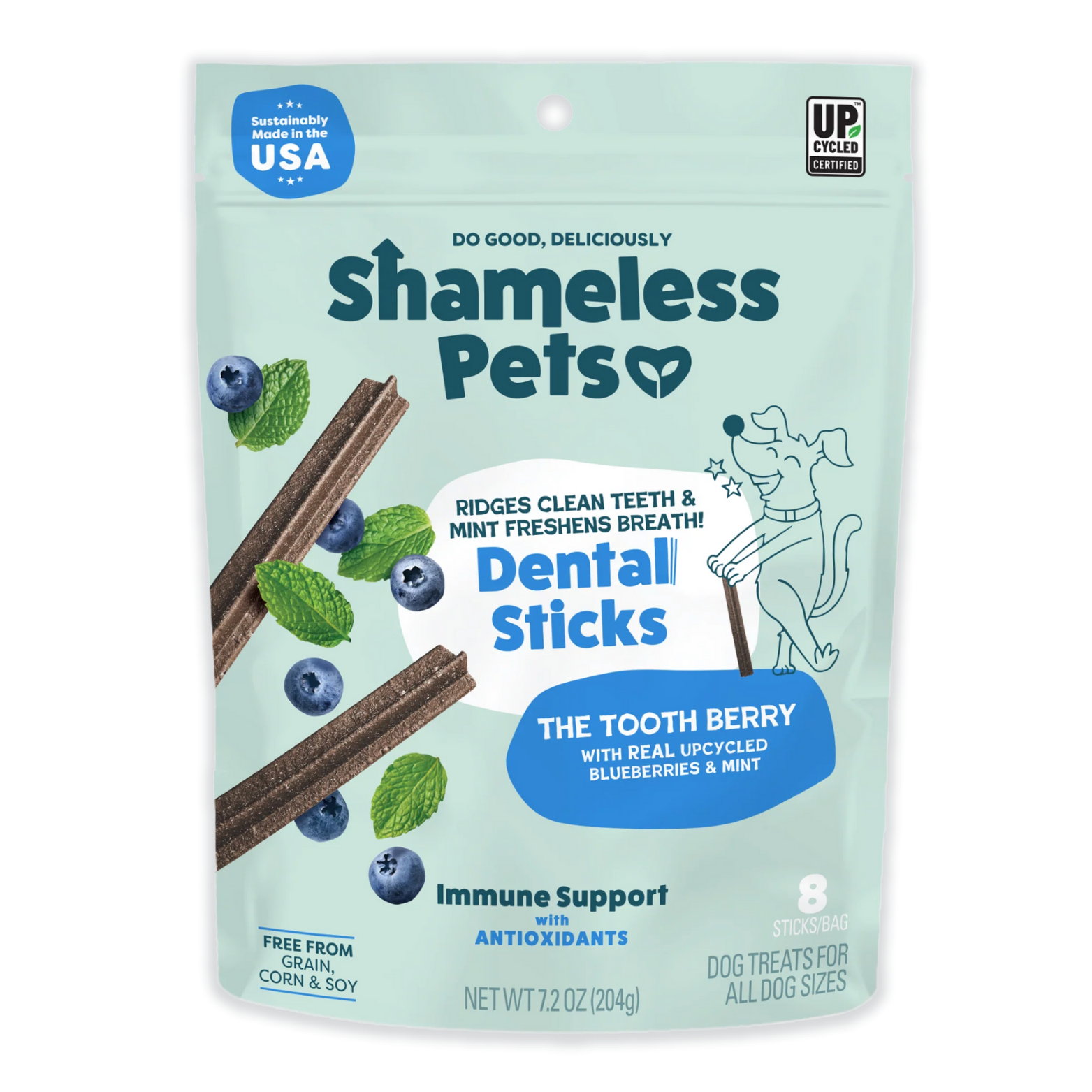 Front of a mint-green Shameless Pets dog treat bag labeled “Dental Sticks – The Tooth Berry,” showing ridged brown dental sticks with blueberries and mint leaves, and text stating they clean teeth, freshen breath, and provide immune support with antioxidants.