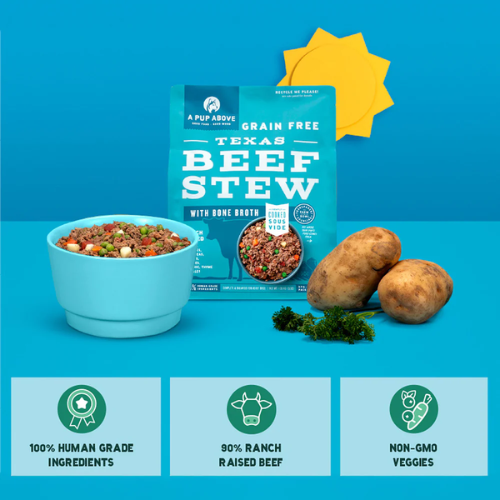 Blue bag of A Pup Above Texas Beef Stew dog food displayed with a bowl of the cooked food, whole potatoes, and herbs, with icons highlighting 100% human-grade ingredients, 90% ranch-raised beef, and non-GMO veggies.