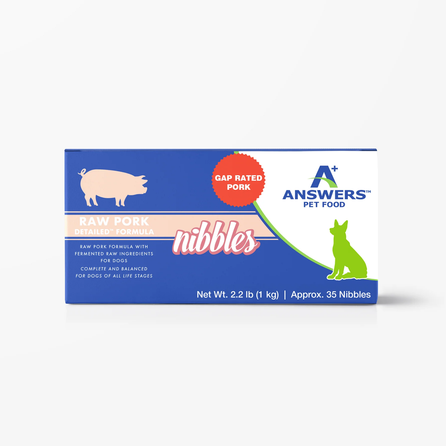 Front view of a blue rectangular box of Answers Pet Food raw pork detailed formula nibbles for dogs. The packaging features a pig icon, the Answers Pet Food logo, “GAP Rated Pork” labeling, and notes that the product contains approximately 35 nibbles with a net weight of 2.2 pounds, alongside a feeding guide showing recommended daily amounts by dog weight.