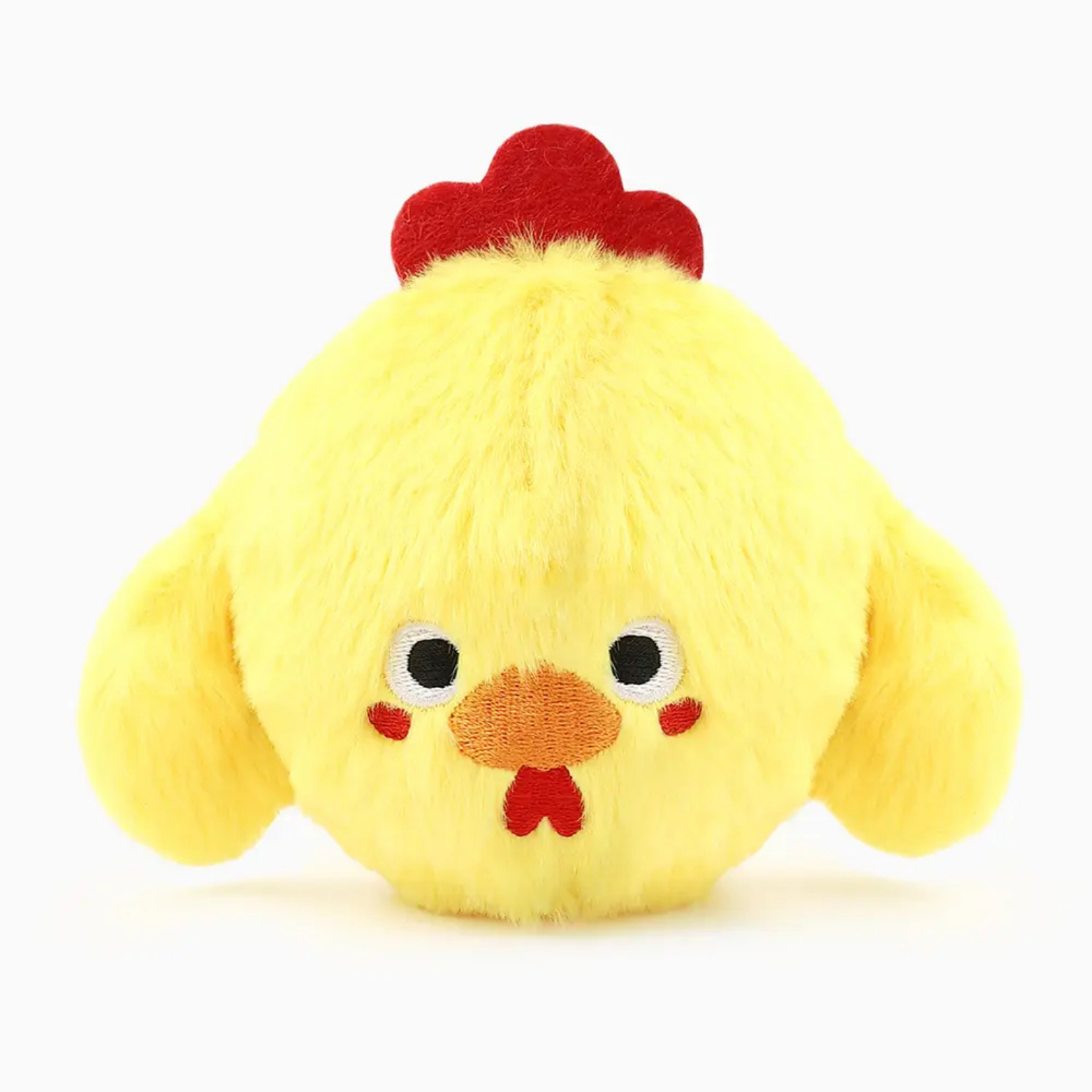Yellow plush toy resembling a chicken with a red comb on a white background
