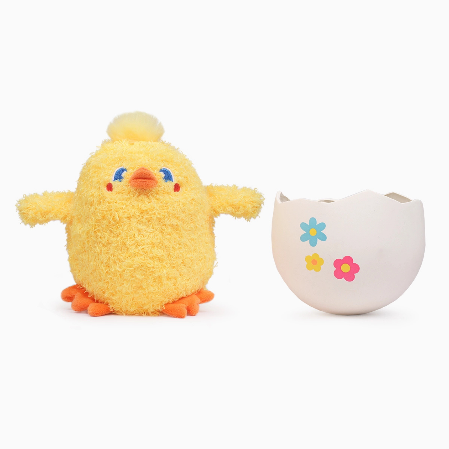 Plush chick toy next to an egg-shaped container on a white background