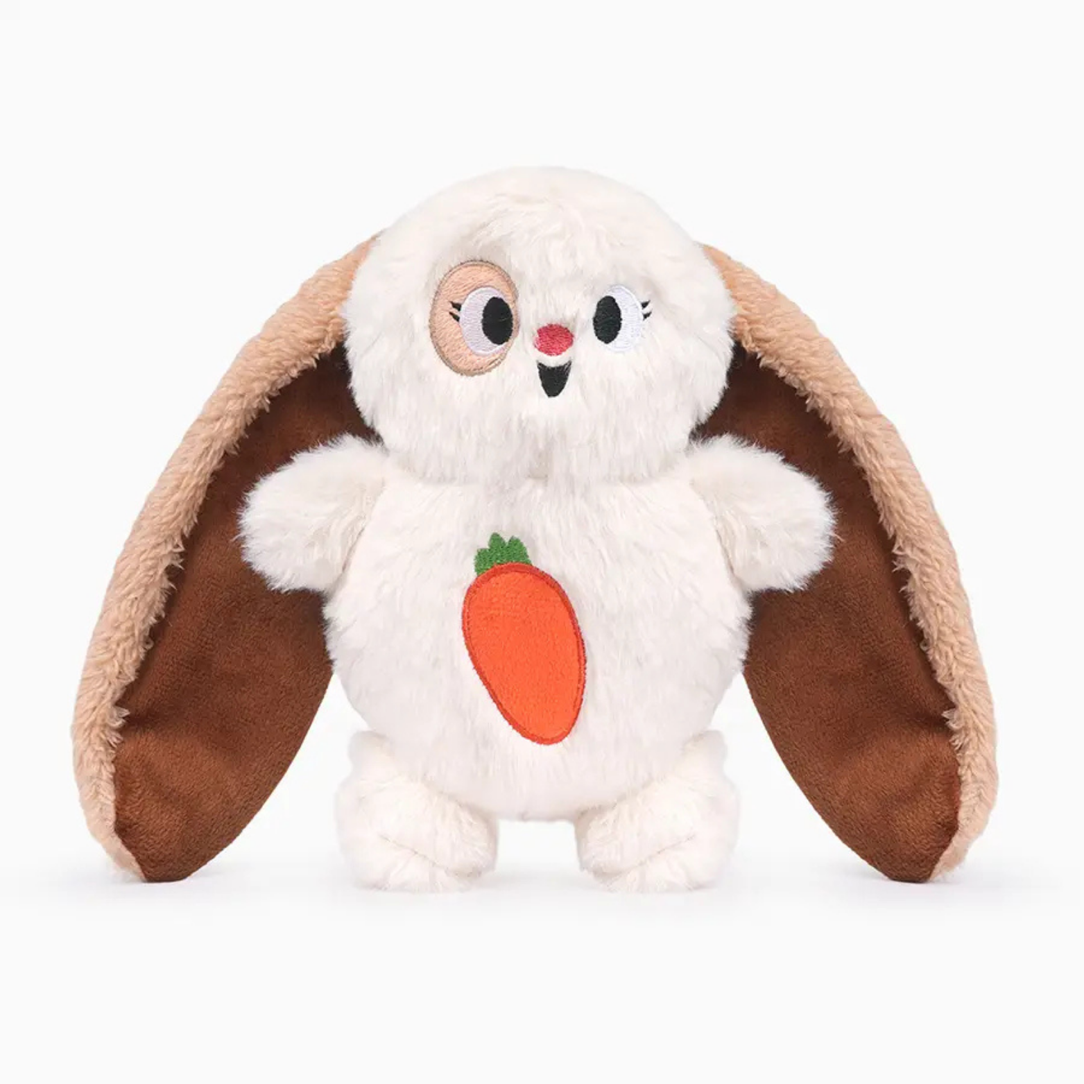 Plush toy resembling a tortoise with a carrot design on a white background