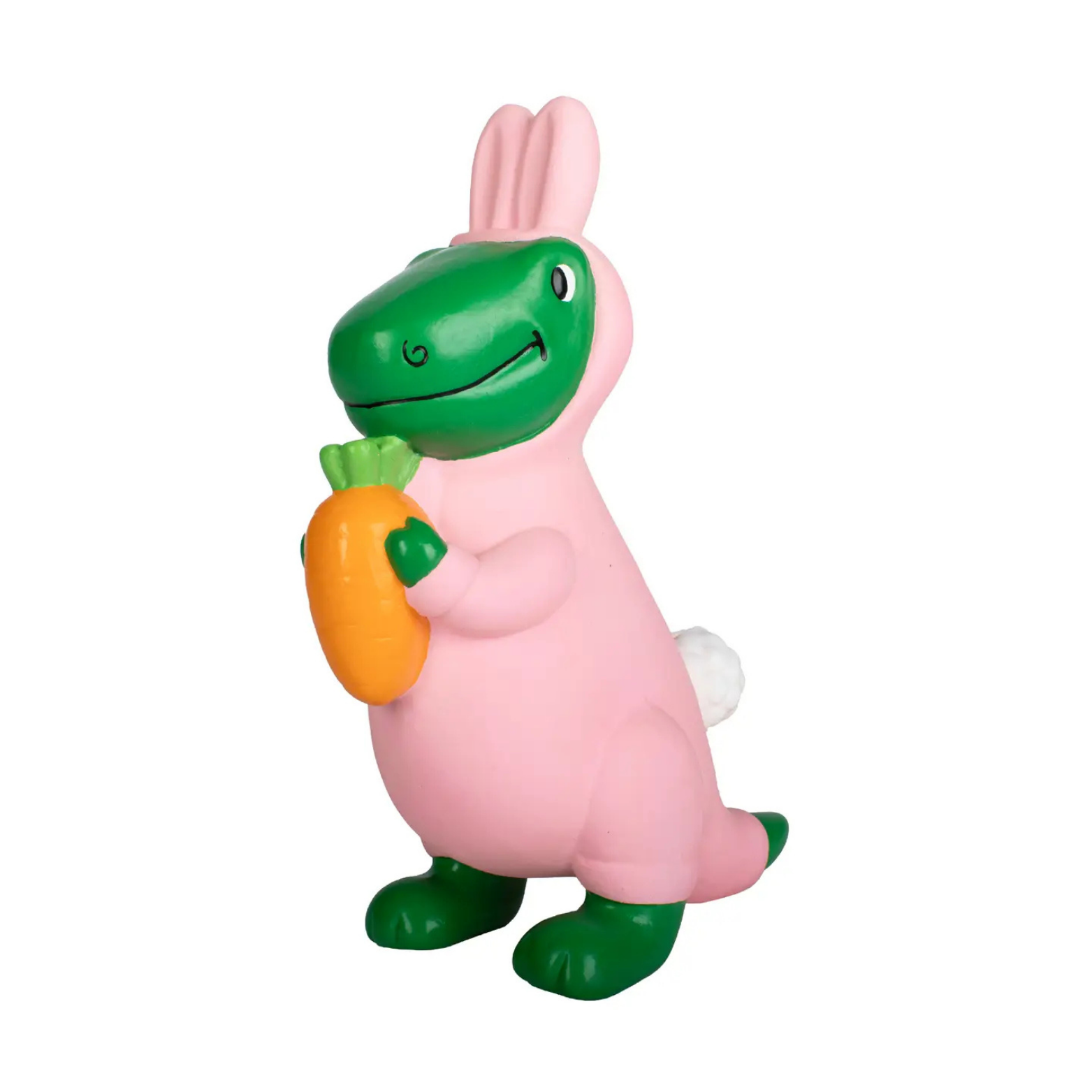 Toy figure of a pink creature with green accents holding a carrot on a white background